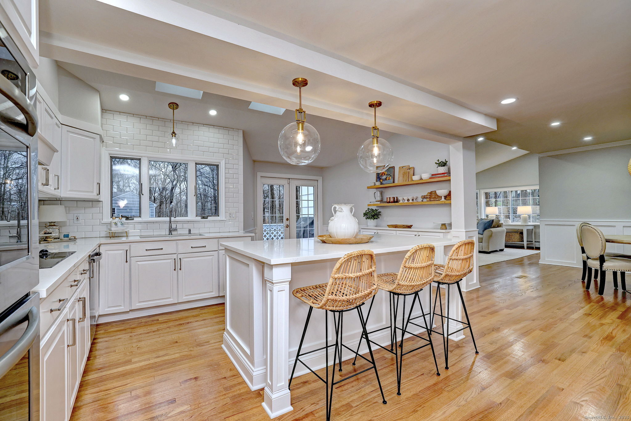 119 Wedgemere Road Stamford, CT 06905 - Photo 3 of 40 a kitchen with stainless steel appliances kitchen island granite countertop a table chairs sink and cabinets