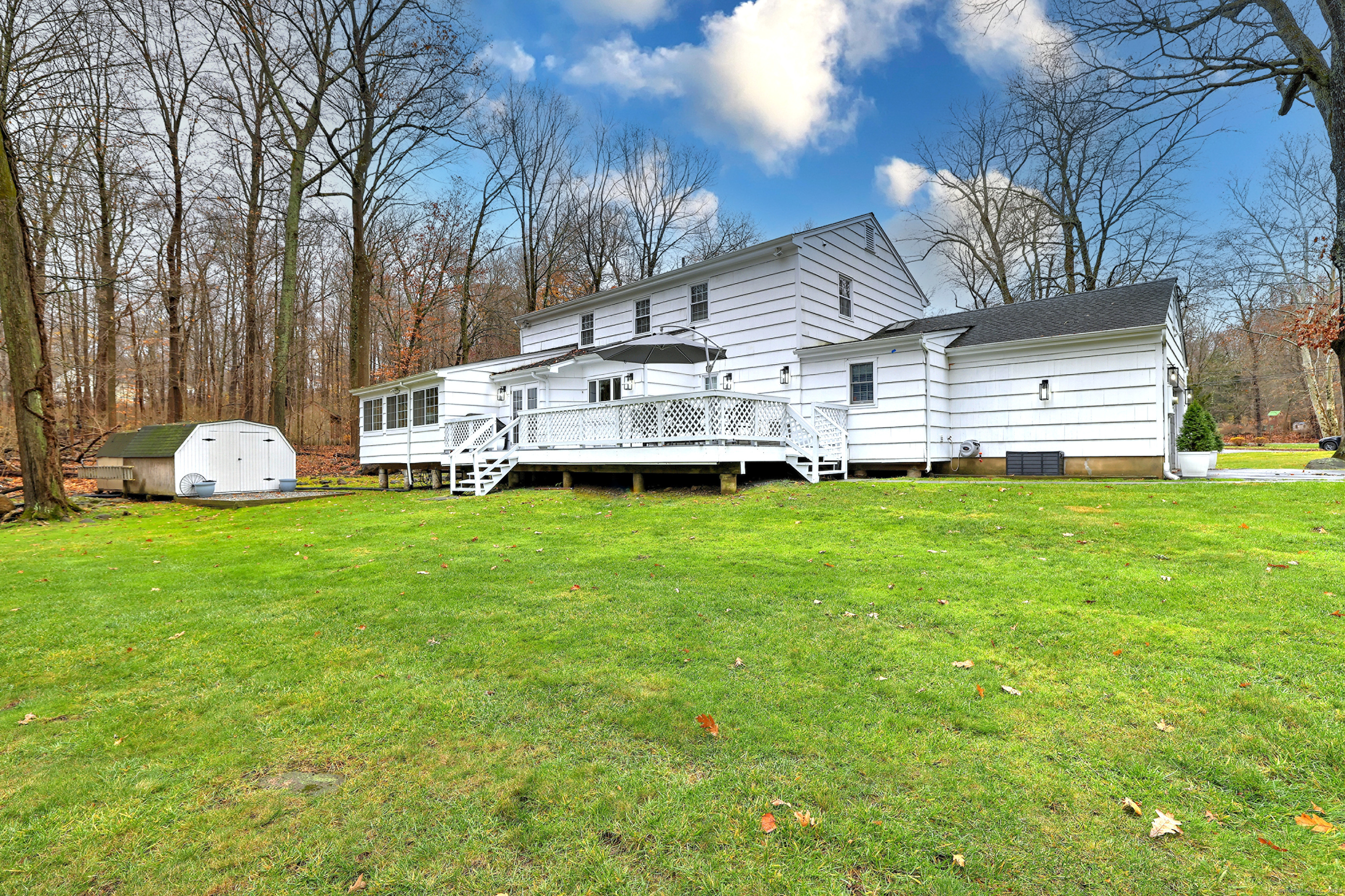 119 Wedgemere Road Stamford, CT 06905 - Photo 34 of 40 a view of a house with a yard and sitting area