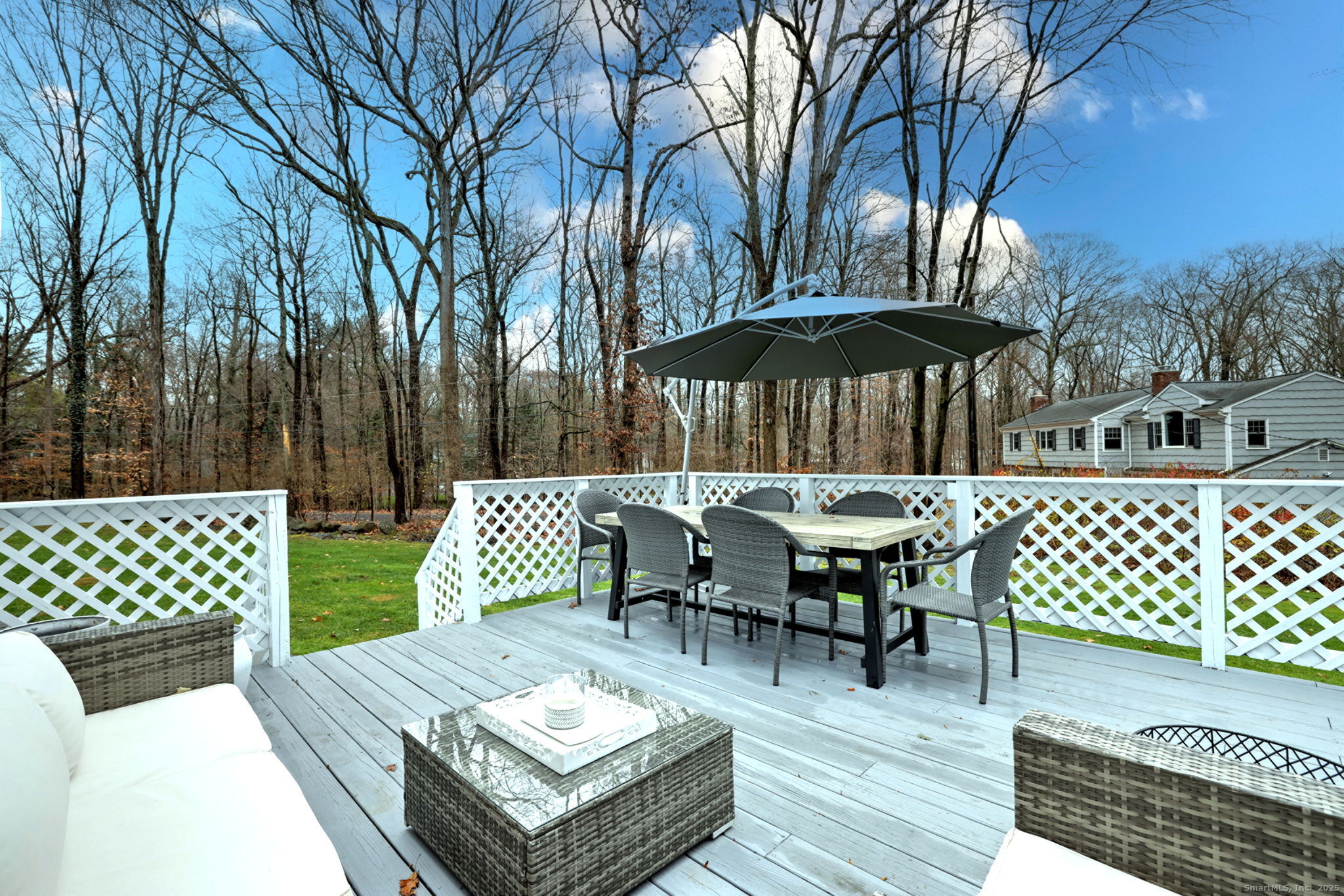 119 Wedgemere Road Stamford, CT 06905 - Photo 35 of 40 a view of a patio with a table chairs and a table