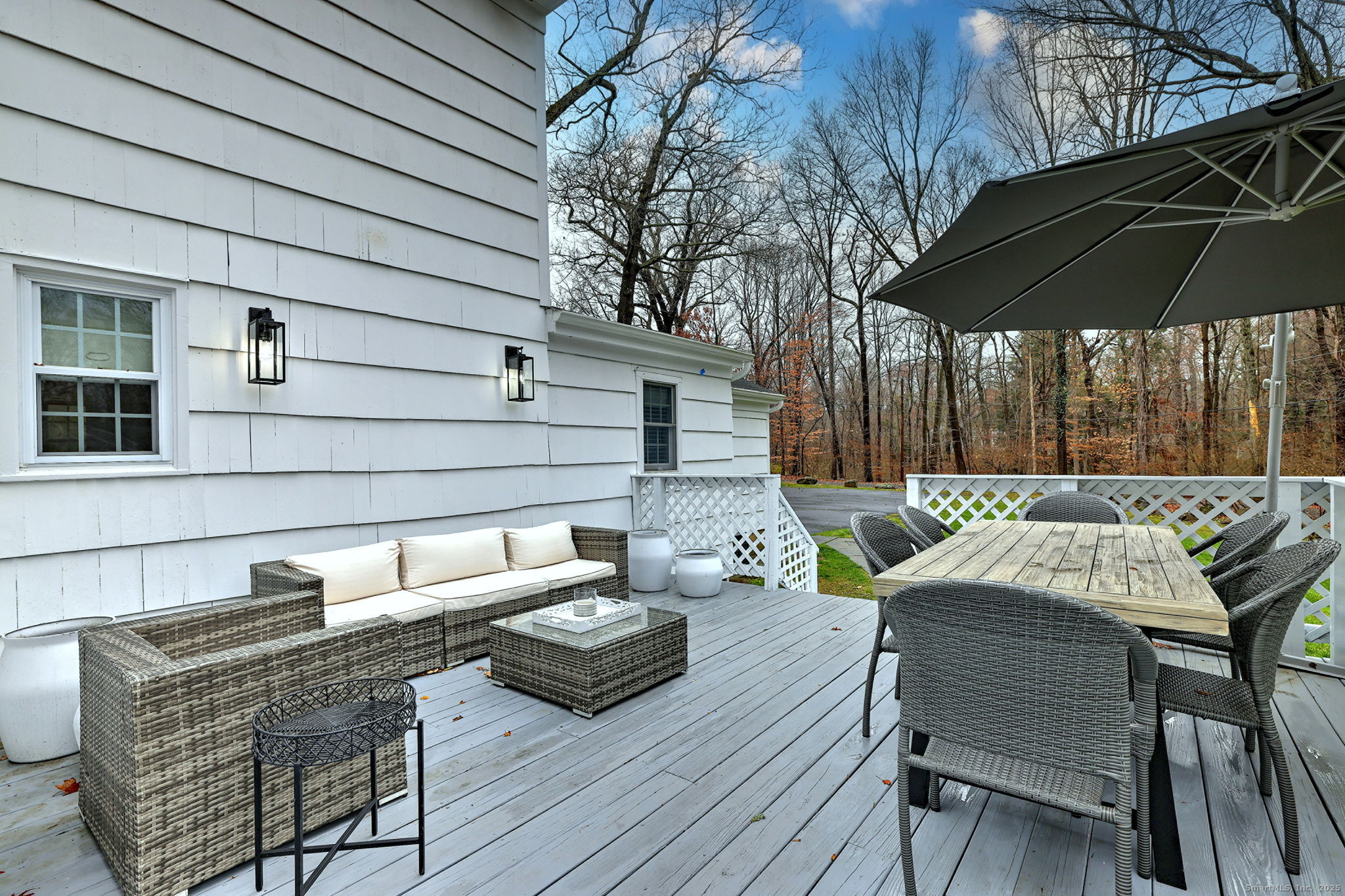 119 Wedgemere Road Stamford, CT 06905 - Photo 36 of 40 a view of table and chairs under an umbrella