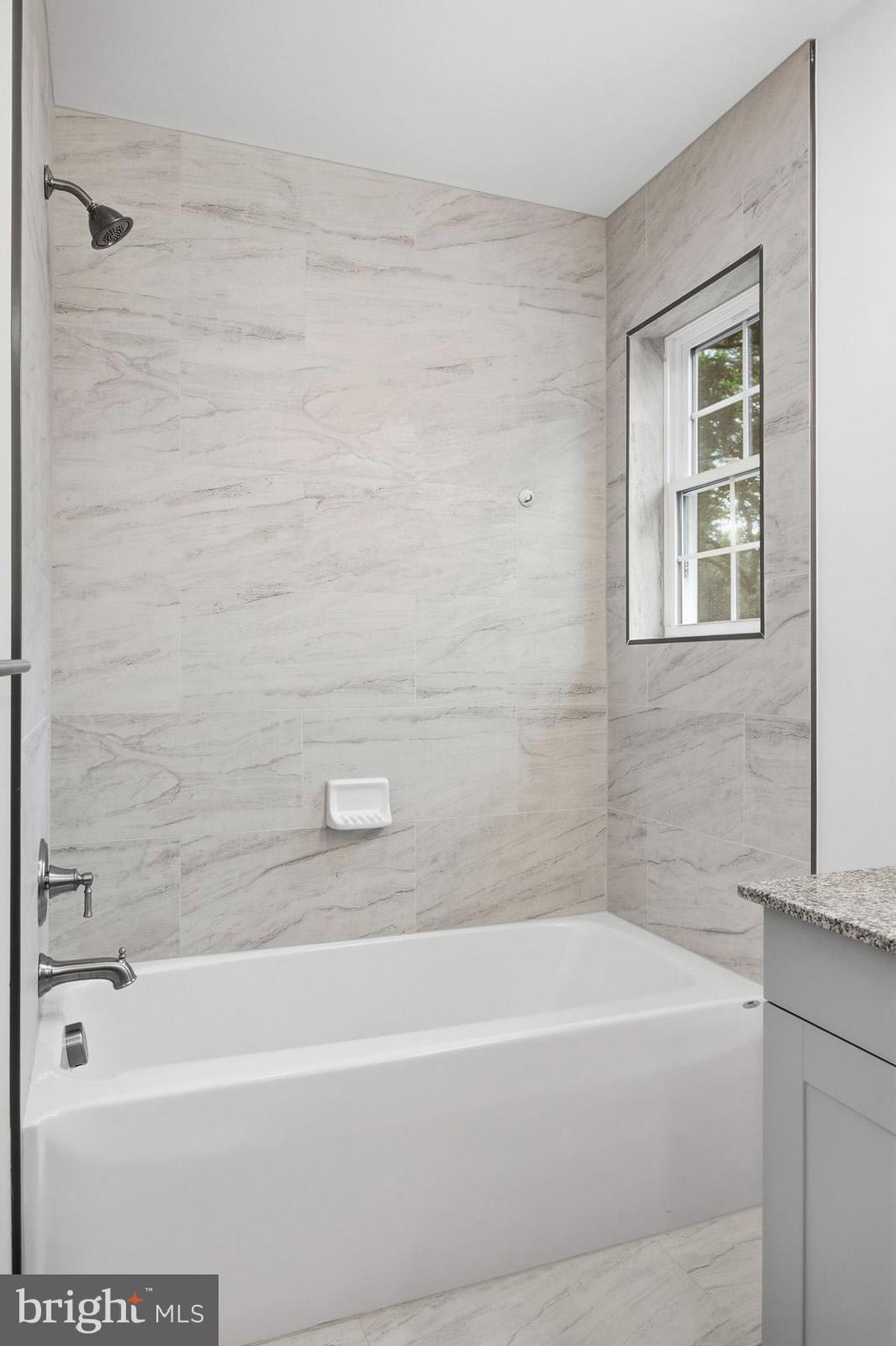 29725 Bruce Road Mechanicsville, MD 20659 - Photo 58 of 79 a bathroom with a bathtub and a shower