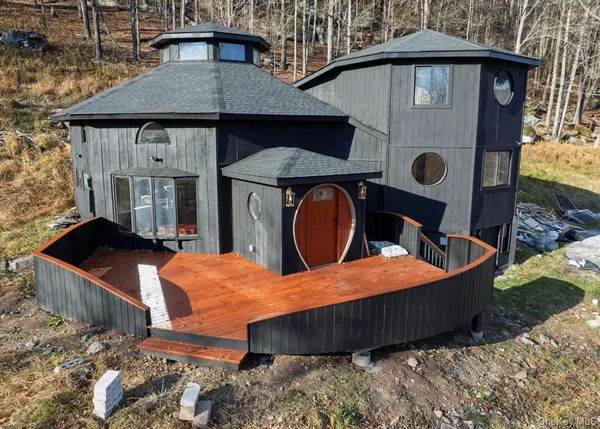 a backyard of a house with barbeque oven