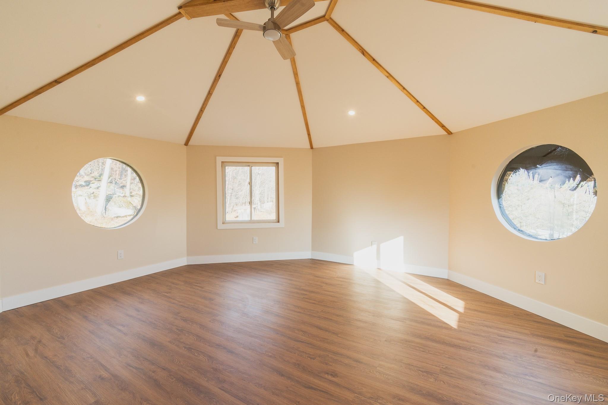 15 Deans Road Napanoch, NY 12458 - Photo 14 of 21 an empty room with wooden floor and windows
