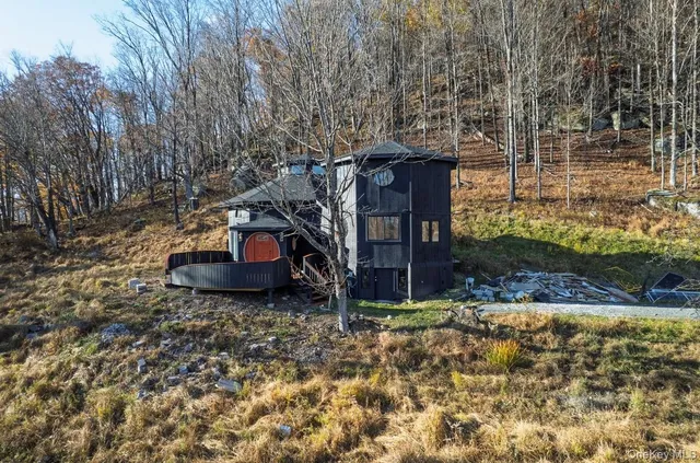 a view of a room with wooden floor and window