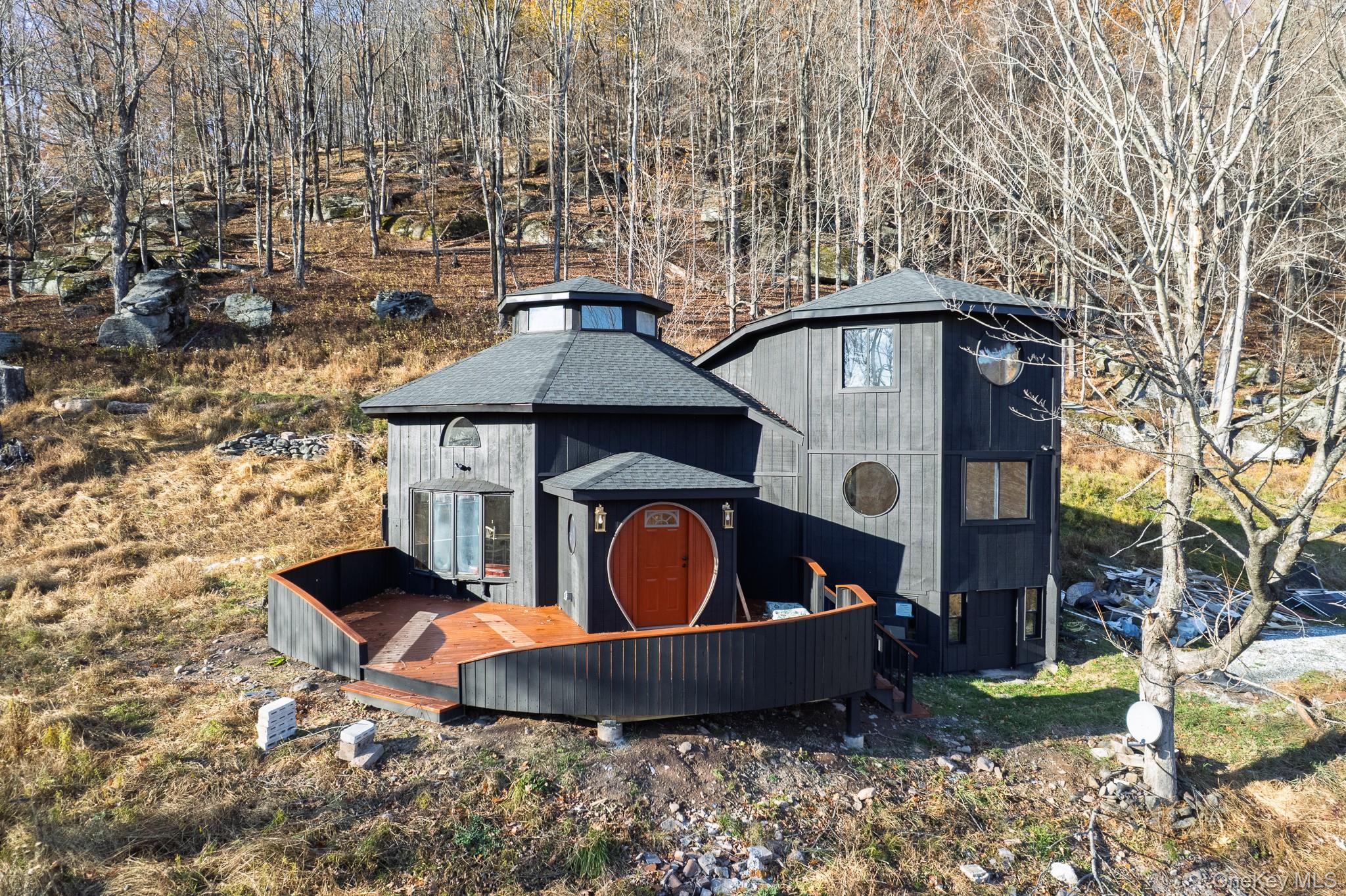 15 Deans Road Napanoch, NY 12458 - Photo 2 of 21 a front view of a house with garden and patio