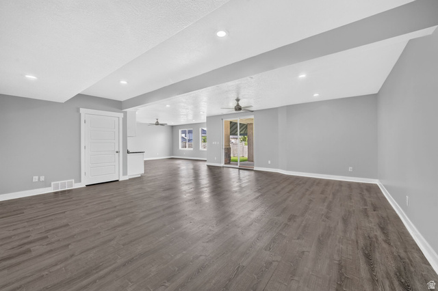 1002 West Temple Rim Lane Payson, UT 84651 - Photo 48 of 68 Spacious open-concept living area featuring wood-finish flooring and recessed lighting