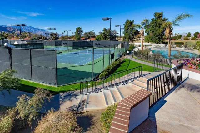 a view of a balcony with wooden floor