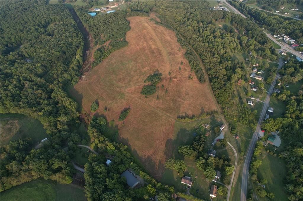 0 Tanner Lane Latrobe, PA 15650 - Photo 9 of 20 an aerial view of a house with a yard and large trees