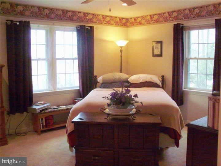 342 Pine Grove Road Nottingham, PA 19362 - Photo 12 of 19 a bedroom with a bed and wooden floor