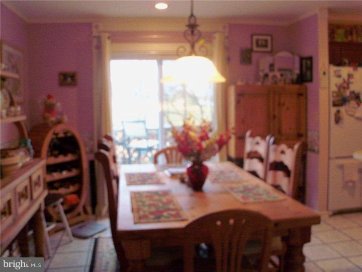 342 Pine Grove Road Nottingham, PA 19362 - Photo 4 of 19 a view of a dining room with furniture and chandelier