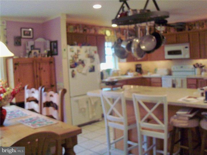 342 Pine Grove Road Nottingham, PA 19362 - Photo 5 of 19 a kitchen with a table and chairs in it