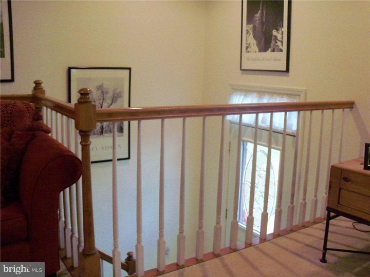 342 Pine Grove Road Nottingham, PA 19362 - Photo 9 of 19 a view of a hallway with wooden floor and windows