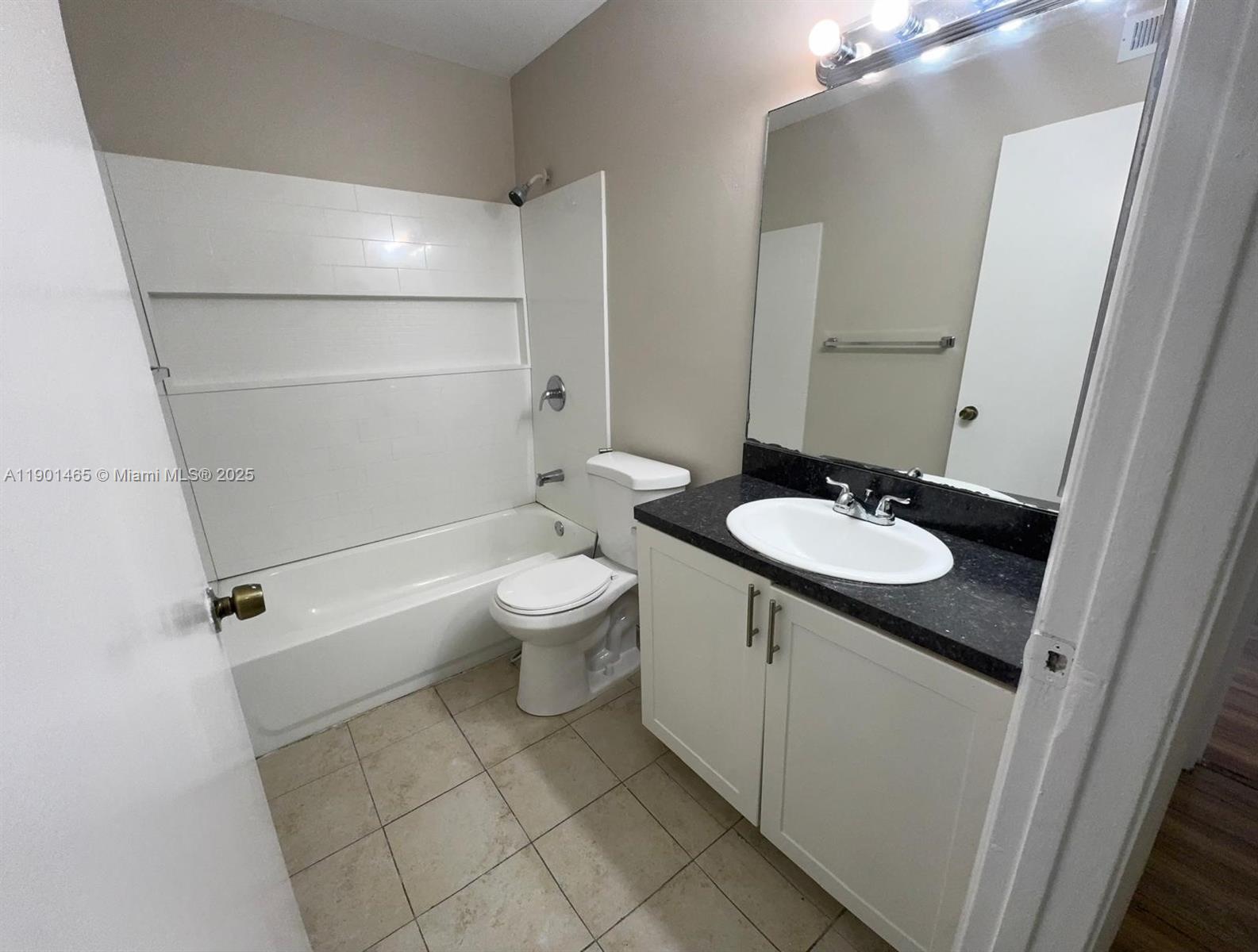 2173 Southwest 80th Terrace, Unit 2173 Miramar, FL 33025 - Photo 14 of 31 a bathroom with a sink a toilet and shower