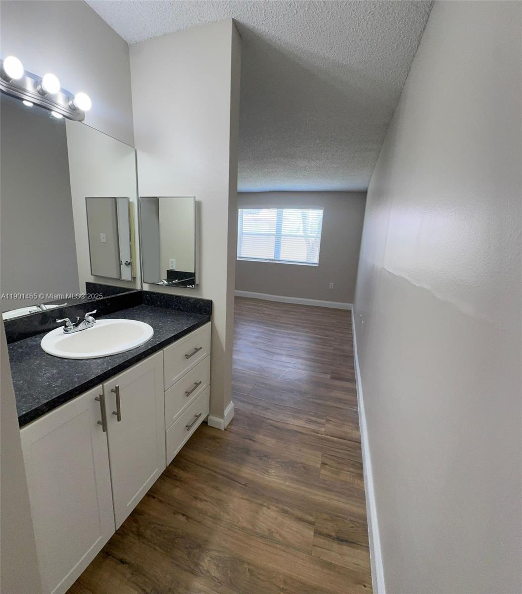 2173 Southwest 80th Terrace, Unit 2173 Miramar, FL 33025 - Photo 21 of 31 a spacious bathroom with a double vanity sink and a mirror