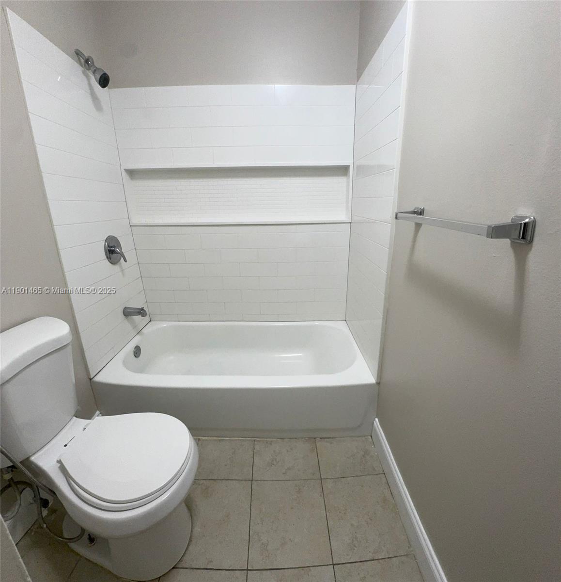 2173 Southwest 80th Terrace, Unit 2173 Miramar, FL 33025 - Photo 22 of 31 a bathroom with a toilet and a bathtub