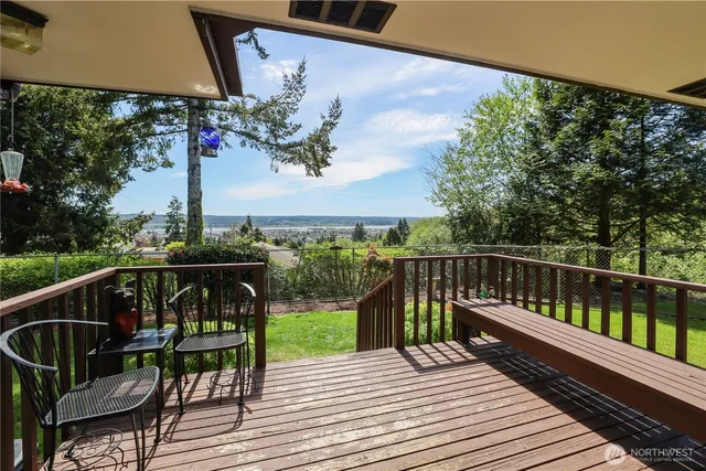 a view of a balcony with chairs