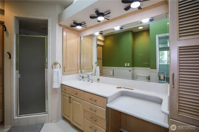 a bathroom with a double vanity sink and mirror