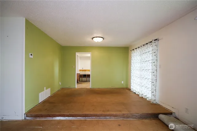 a view of a big room with windows