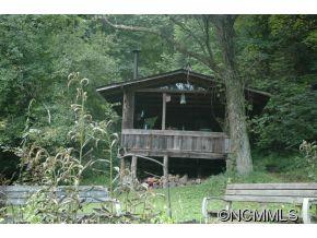 Na Heck Creek Road Marshall, NC 28753 - Photo 9 of 12 a view of house with a yard