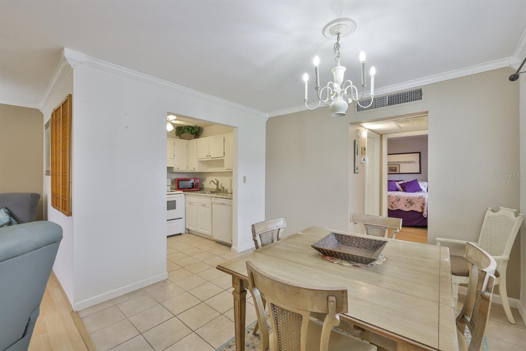 1901 Andover Way, Unit 38 Sun City Center, FL 33573 - Photo 11 of 54 a view of a dining room with furniture and chandelier