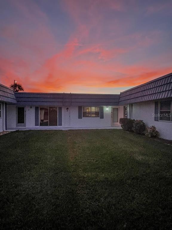 1901 Andover Way, Unit 38 Sun City Center, FL 33573 - Photo 2 of 54 a view of a house with a yard