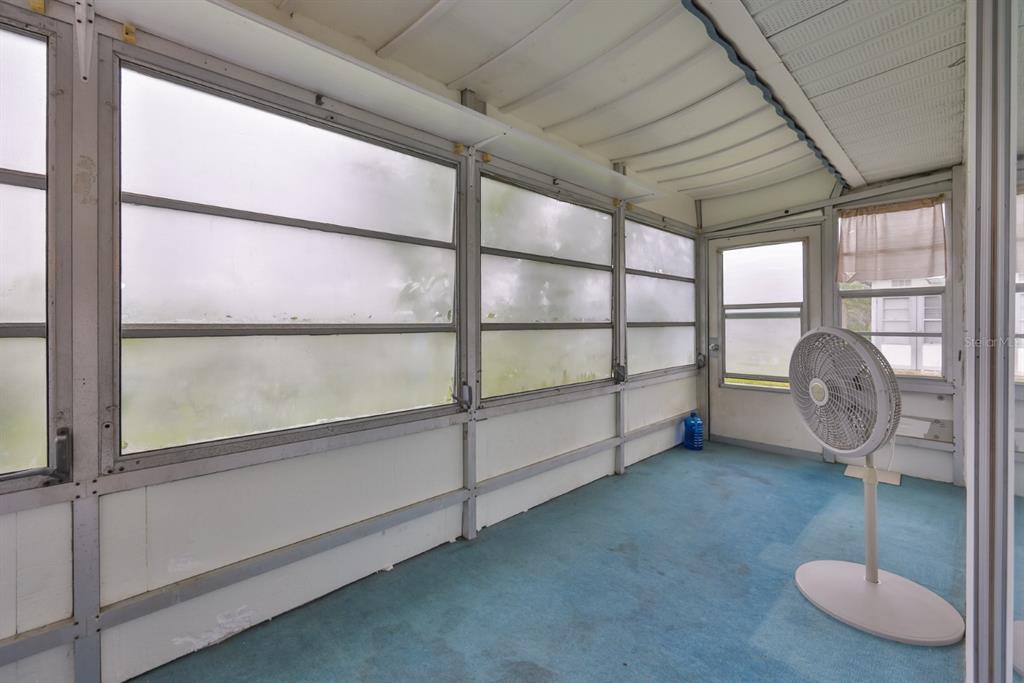 1901 Andover Way, Unit 38 Sun City Center, FL 33573 - Photo 24 of 54 a view of a livingroom with wooden floor and windows