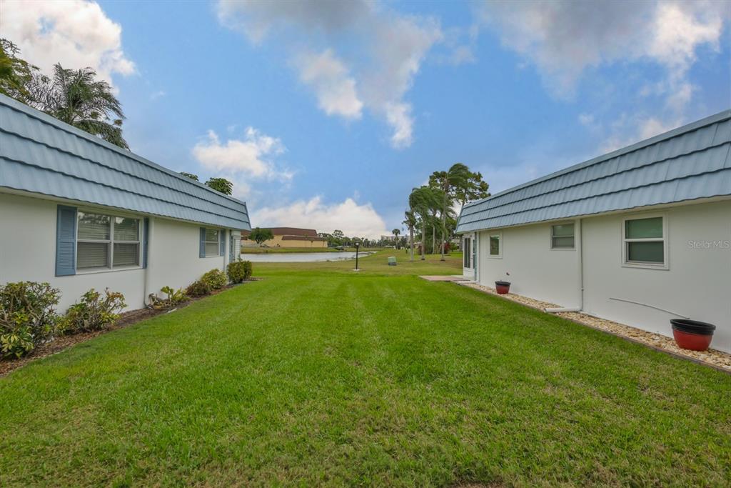 1901 Andover Way, Unit 38 Sun City Center, FL 33573 - Photo 26 of 54 a front view of house with yard and green space