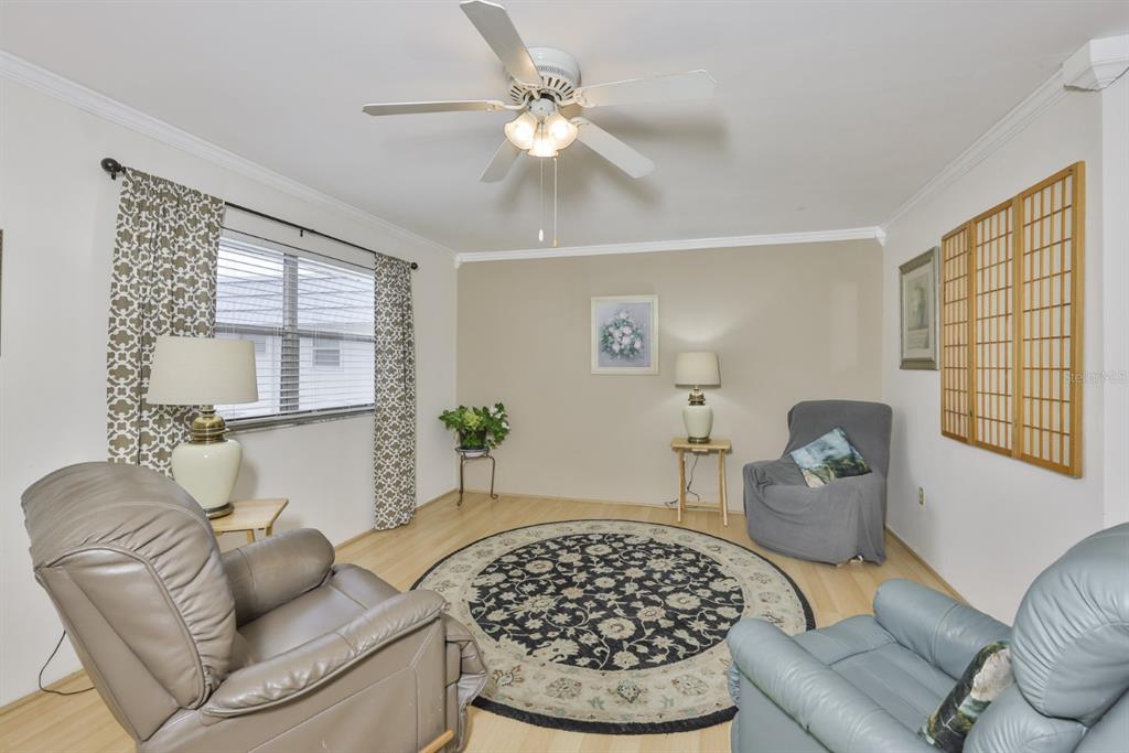 1901 Andover Way, Unit 38 Sun City Center, FL 33573 - Photo 7 of 54 a living room with furniture and a window