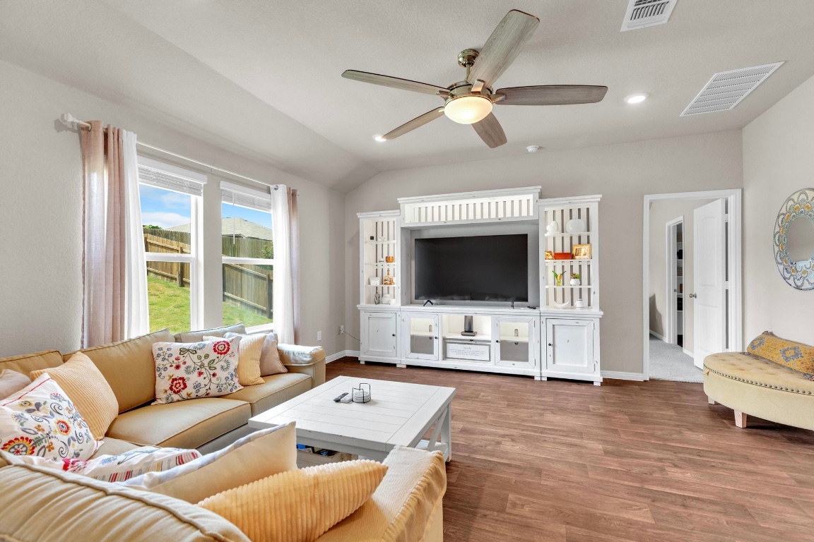 19525 Abigail Fillmore Road Manor, TX 78653 - Photo 12 of 40 Living room featuring lofted ceiling, wood finished floors, recessed lighting, and ceiling fan