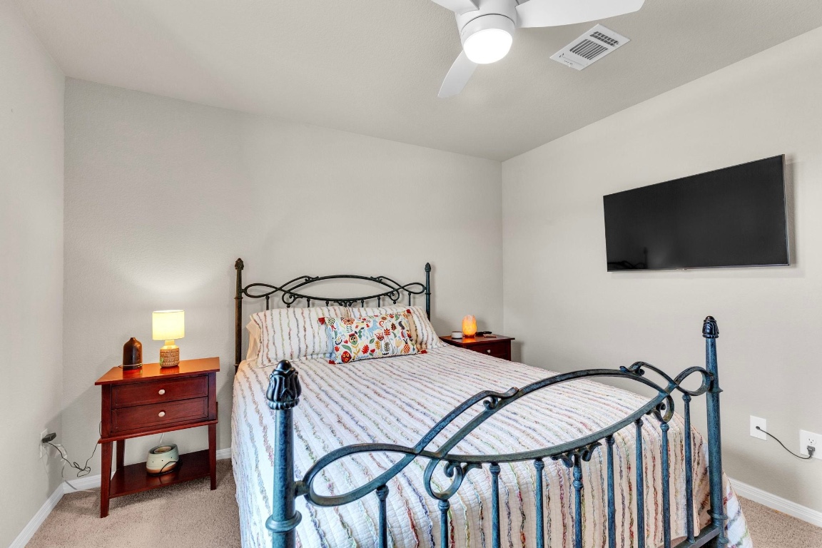 19525 Abigail Fillmore Road Manor, TX 78653 - Photo 18 of 40 Bedroom with carpet floors and ceiling fan