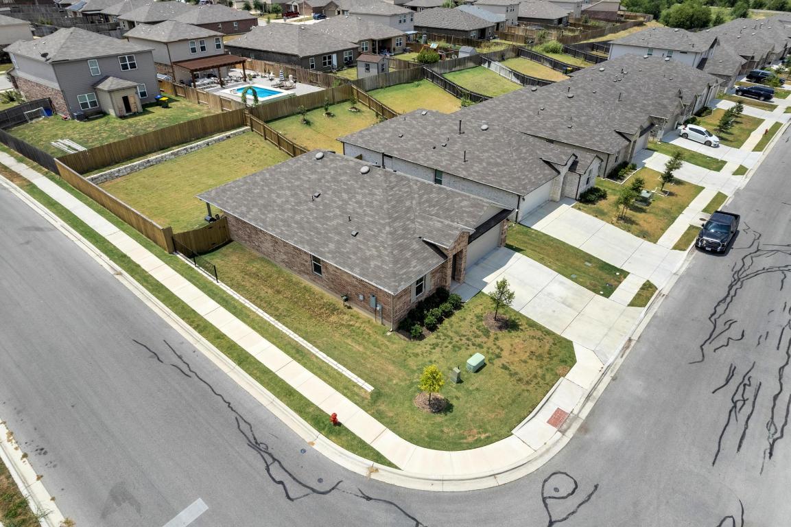 19525 Abigail Fillmore Road Manor, TX 78653 - Photo 34 of 40 Aerial view of residential area featuring a pool area