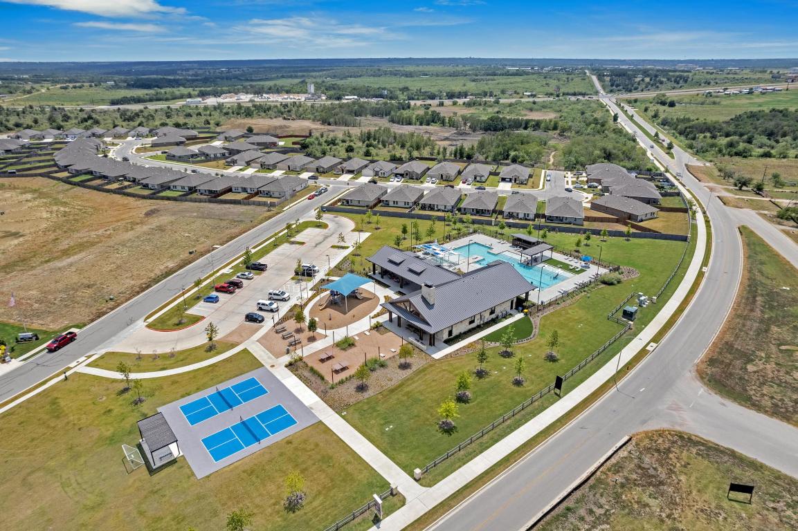 19525 Abigail Fillmore Road Manor, TX 78653 - Photo 37 of 40 Aerial perspective of suburban area with a pool
