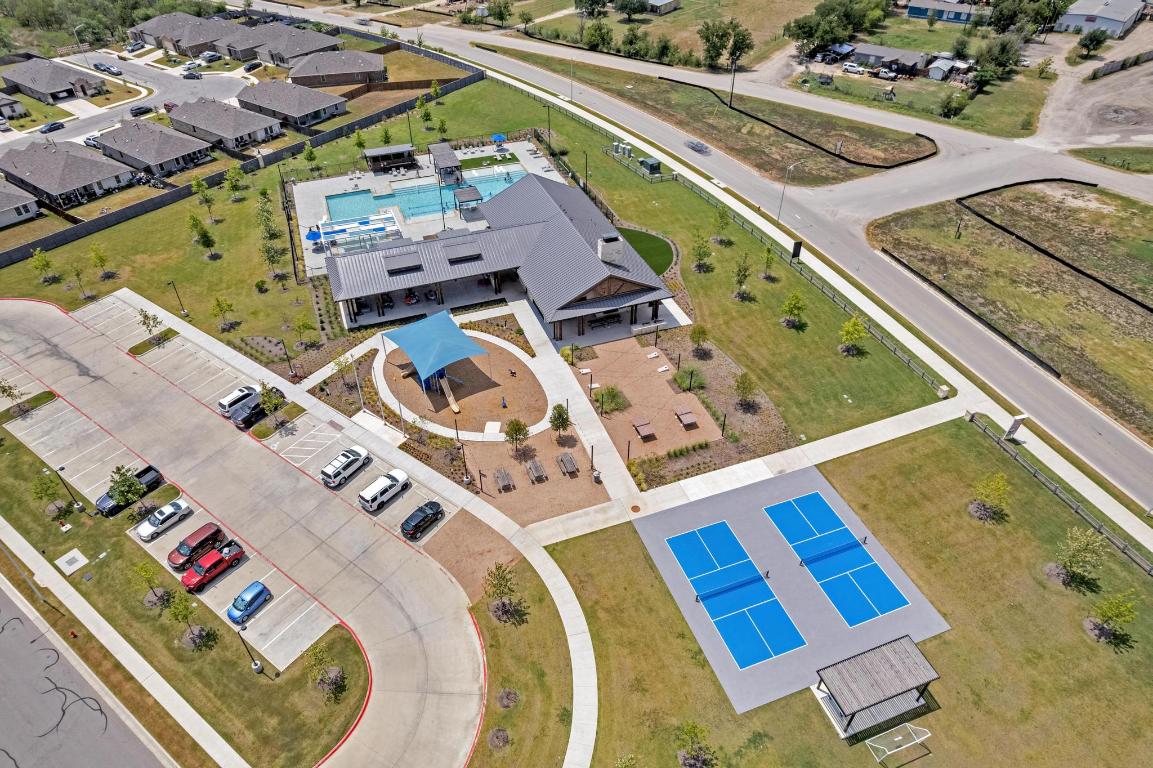 19525 Abigail Fillmore Road Manor, TX 78653 - Photo 38 of 40 Aerial perspective of suburban area featuring a pool area
