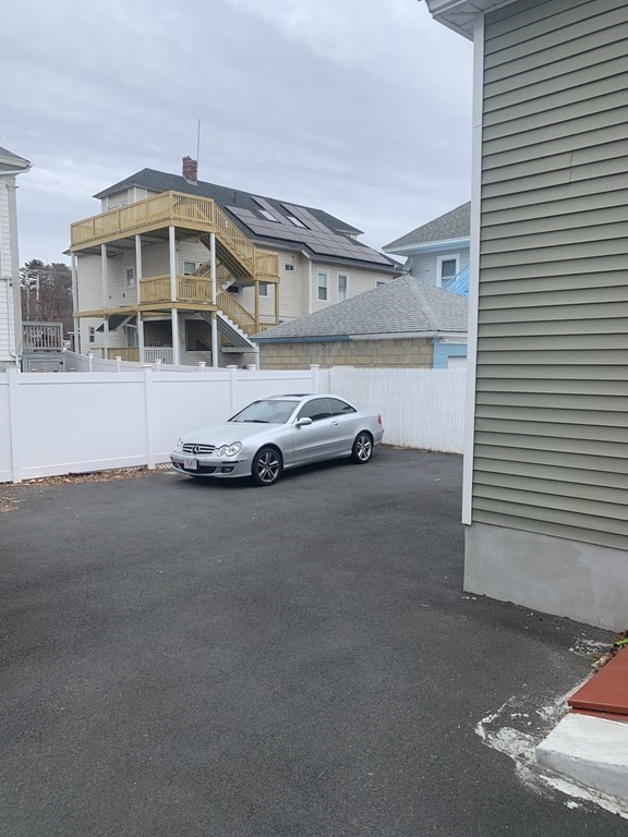 243 Bruce Street Lawrence, MA 01841 - Photo 6 of 16 a car parked in front of a house