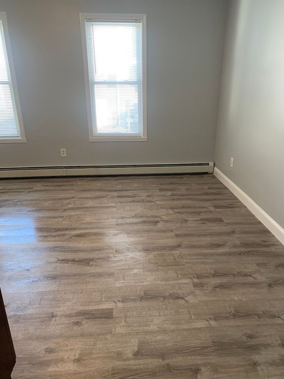 243 Bruce Street Lawrence, MA 01841 - Photo 10 of 16 wooden floor in an empty room