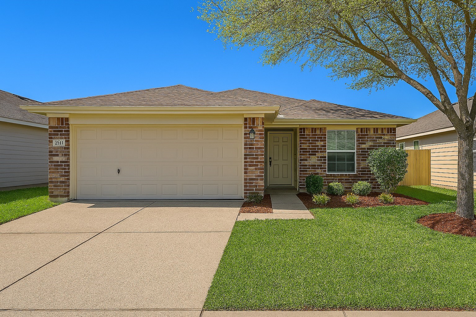 3611 Apache Meadows Drive Baytown, TX 77521 - Photo 1 of 12 a front view of a house with a yard and garage