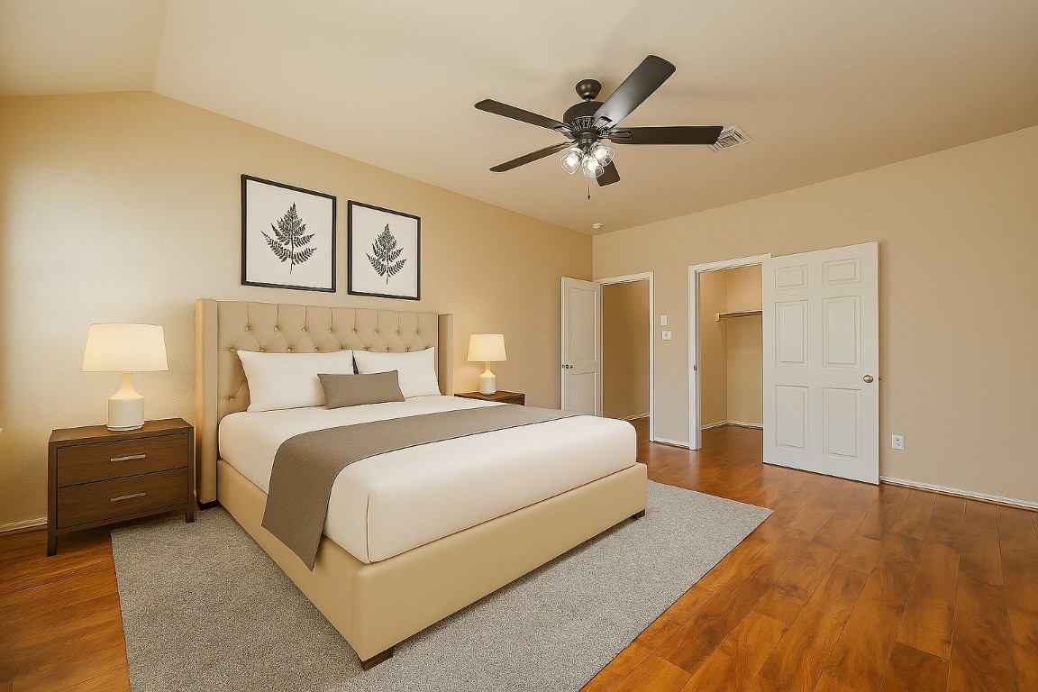 3611 Apache Meadows Drive Baytown, TX 77521 - Photo 5 of 12 a spacious bedroom with a bed and a chandelier