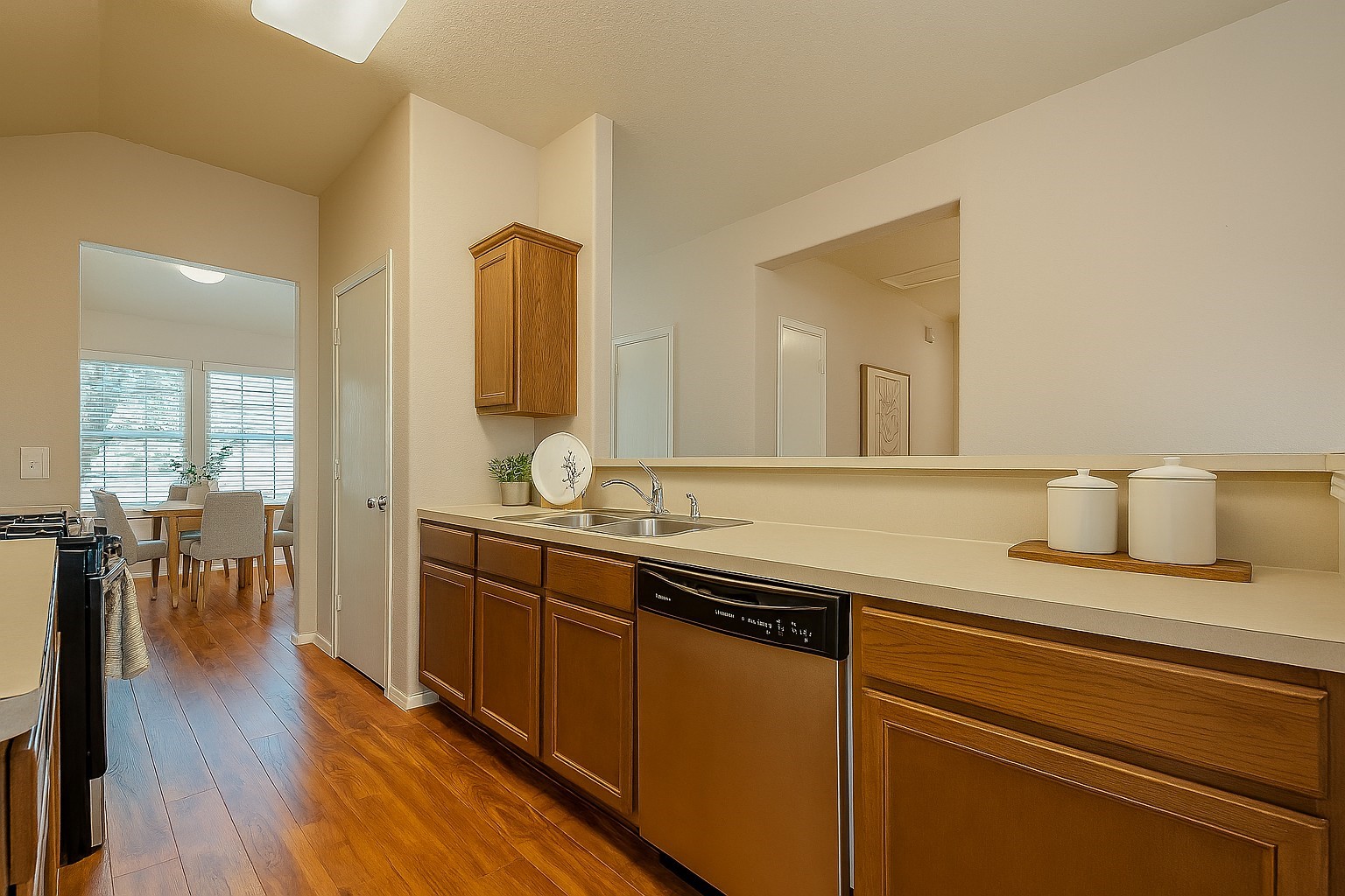 3611 Apache Meadows Drive Baytown, TX 77521 - Photo 9 of 12 a spacious bathroom with a granite countertop sink and a mirror