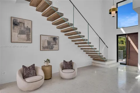 a view of a livingroom with furniture and window