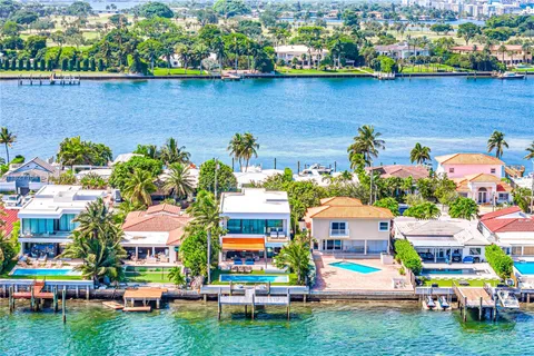a spacious bathroom with a double vanity sink and a large mirror
