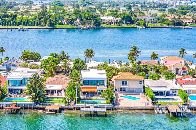 a spacious bathroom with a double vanity sink and a large mirror
