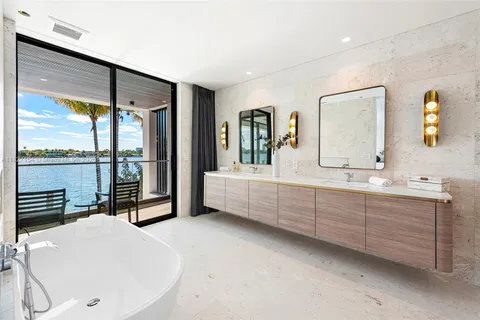 a bathroom with a sink toilet and mirror