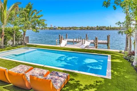 a view of a swimming pool with a lake view
