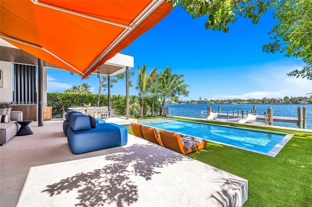 a bedroom with a bed and a view of balcony