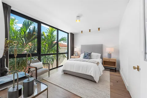 a view of a house with swimming pool and sitting area