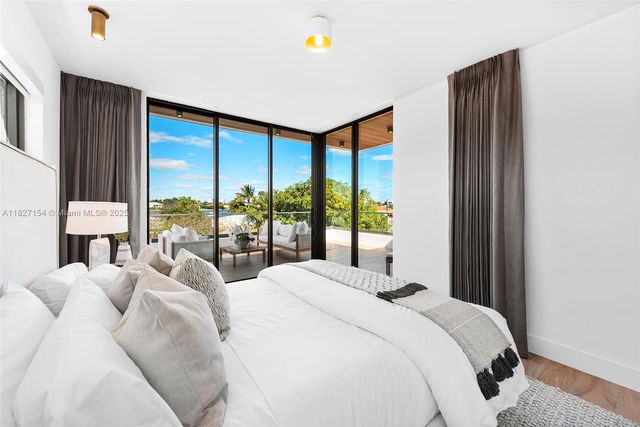 a outdoor space with lots of white furniture