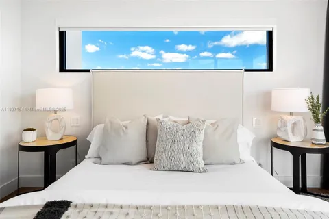 a view of swimming pool with outdoor seating and yard in the back