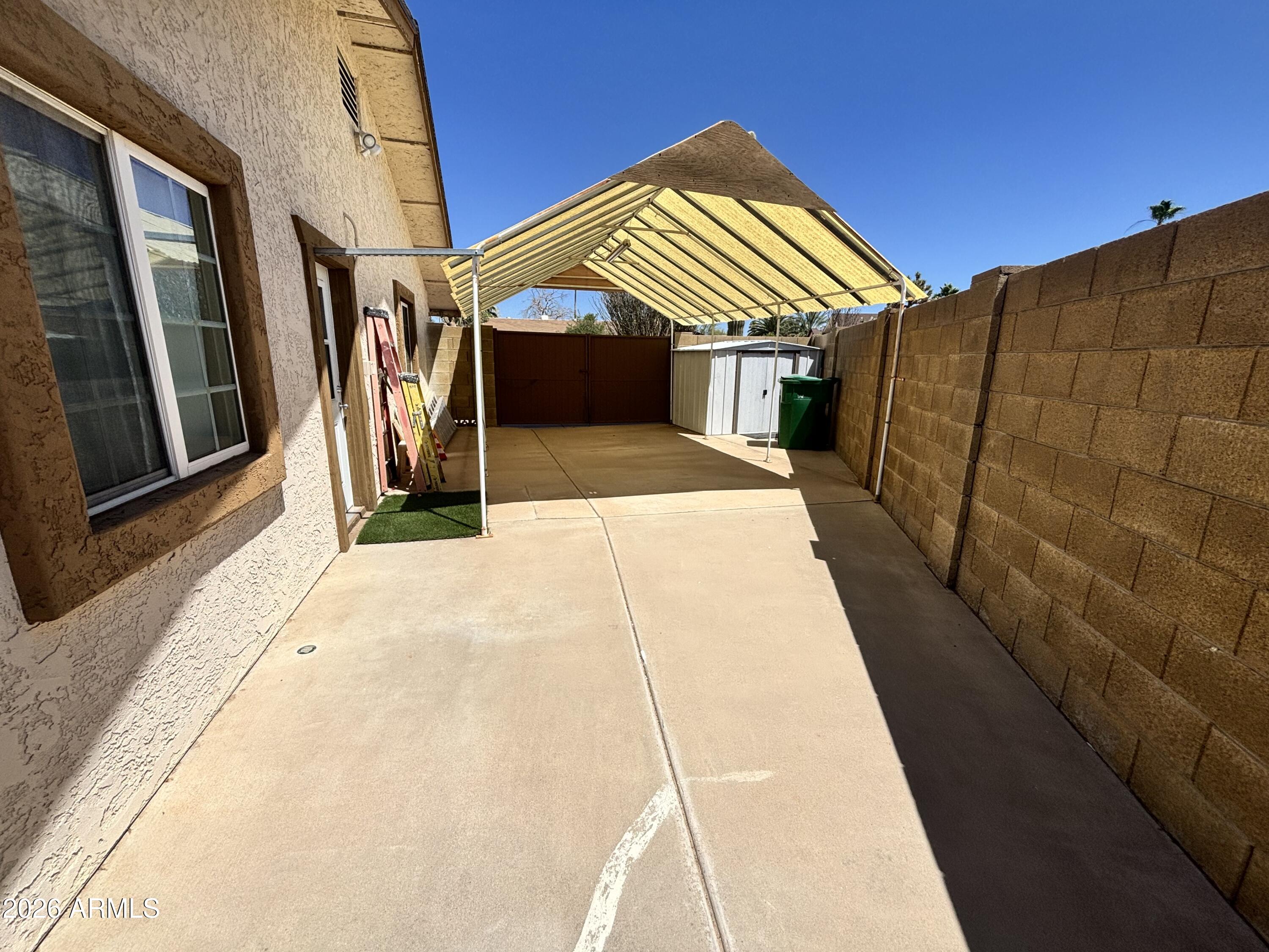 7745 East Mangun Road Mesa, AZ 85207 - Photo 6 of 35 a front view of a house with a garage