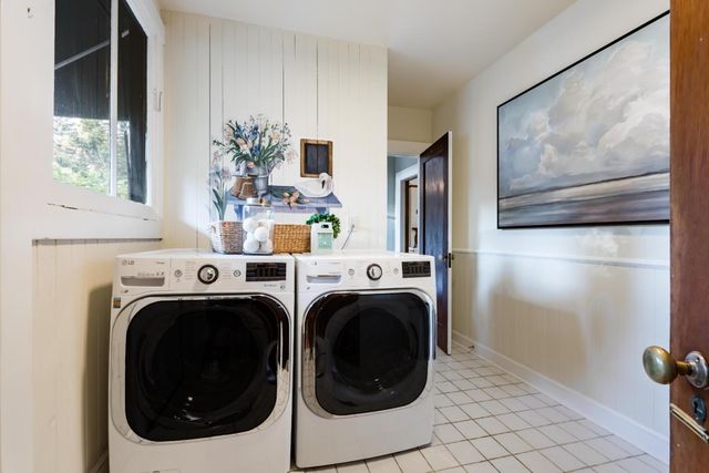 a view of a hallway with washer and dryer