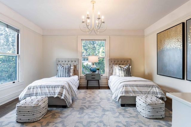 a bedroom with bed and a window